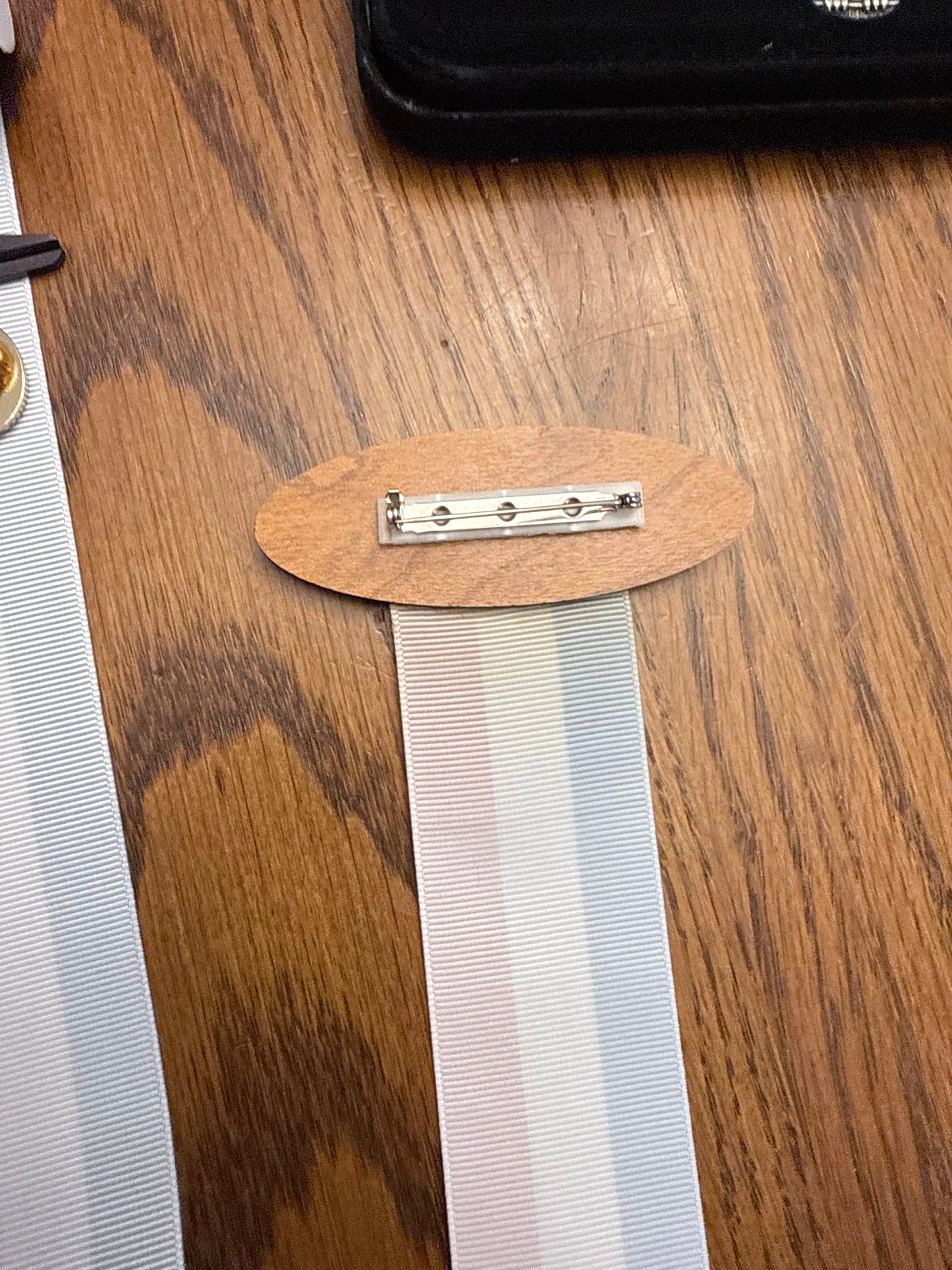 Name tag with ribbon for pins