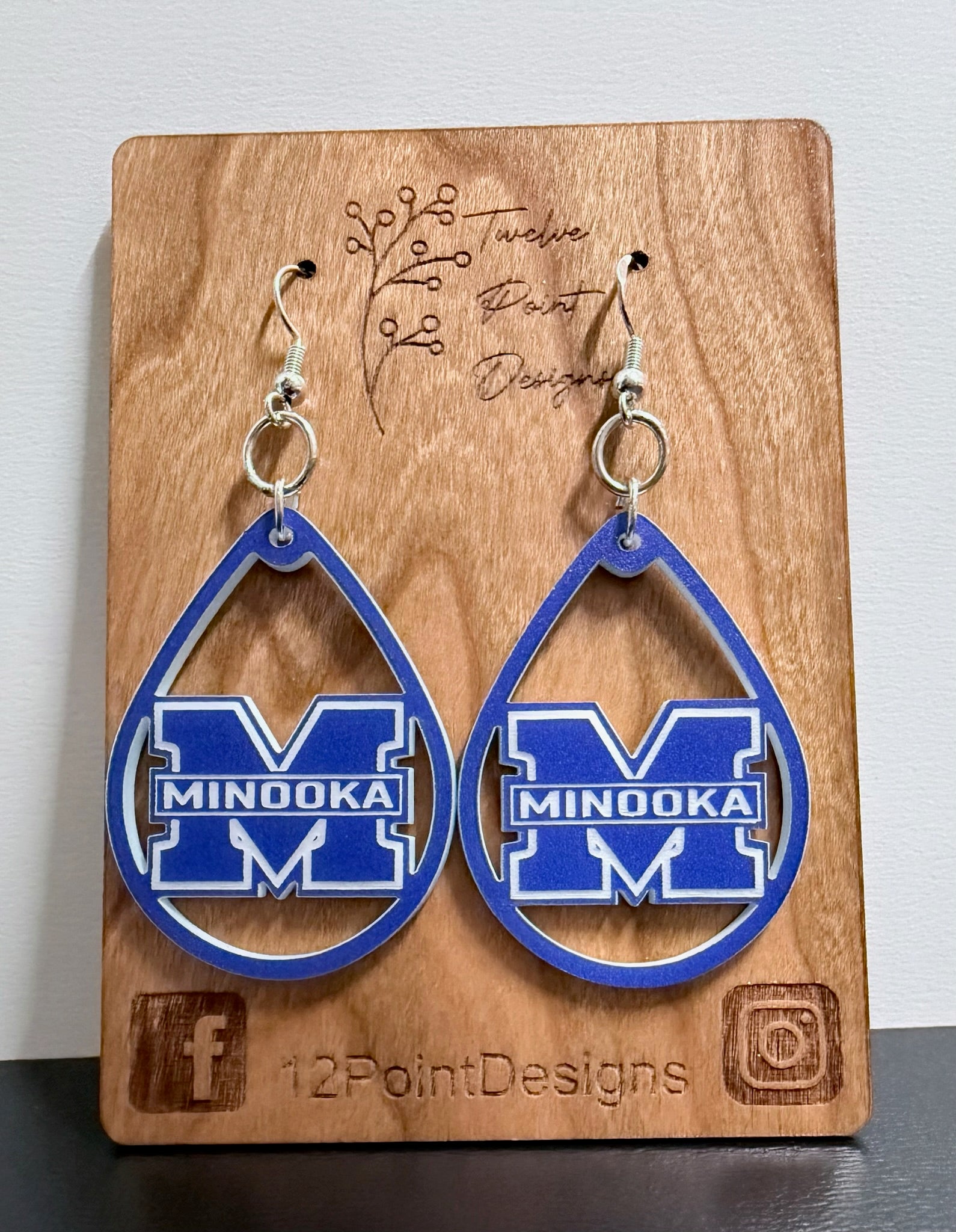 Teardrop earring on card